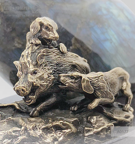 Bronze boar and dogs figures with labradorite on a dolerite plate