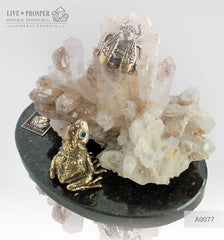 Bronze frog and Fly figures with Demantoid inserts with Quartz on a Dolerite plate
