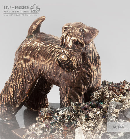 Bronze figure of a dog breed Fox Terrier with calcite and pyrite on a dolerite plate