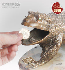 Bronze figure of frog with demantoids inserts on a marvel plate