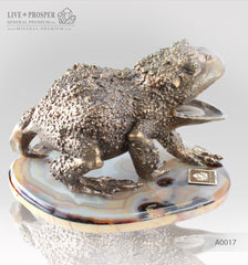 Bronze figure of frog with demantoids inserts on a marvel plate