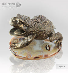 Bronze figure of frog with demantoids inserts on a marvel plate