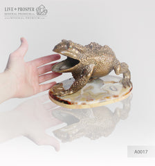 Bronze figure of frog with demantoids inserts on a marvel plate