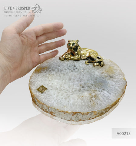 Handmade bronze tiger with demantoids inserts on an agate plate
