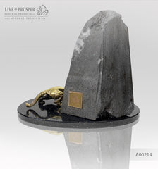 Handmade bronze tiger figure with demantoid inserts and geode's amethyst druzy background at dolerite plate 