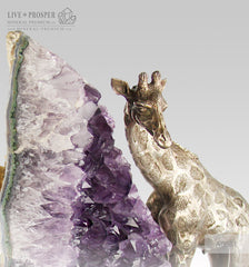 amethyst with bronze giraffe figure with amethyst on dolerite plate 