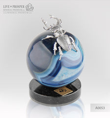  Silver figure of beetle deer on agate sphere and a dolerite plate  Серебренный жук олень на сфере из агата на пластине из долерита  Silver figure of beetle deer on agate sphere and a dolerite plate silver 925 Серебренный жук олень на сфере из агата на пластине из долерита серебро 925 проба