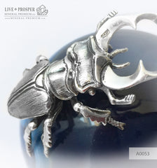  Silver figure of beetle deer on agate sphere and a dolerite plate  Серебренный жук олень на сфере из агата на пластине из долерита  Silver figure of beetle deer on agate sphere and a dolerite plate silver 925 Серебренный жук олень на сфере из агата на пластине из долерита серебро 925 проба