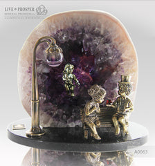 Bronze Figure of Sweethearts on a Bench  with Garnet heart