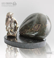 Bronze figure of monkey philosophy with labradorite on dolerite plate