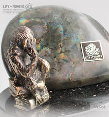 Bronze figure of monkey philosophy with labradorite on dolerite plate