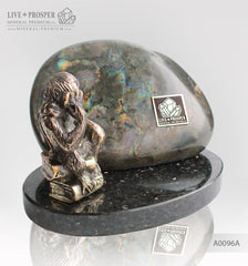 Bronze figure of monkey philosophy with labradorite on dolerite plate