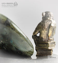 Bronze figure of monkey philosophy with labradorite on dolerite plate