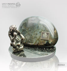 Bronze figure of monkey philosophy with labradorite on dolerite plate