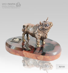 Bronze bull with bush on agate and marvel plate