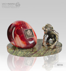 Bronze figure of monkey on guard with carnelian on marvel plate