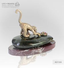 Bronze figures of Monkey and Ladybug with Demantoid inserts With labradorite on Marvel plate
