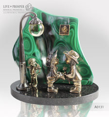 Bronze cupid and sweethearts with citrine sphere on a dolerite plate with malachite background Бронзовые купидон и влюбленные с шаром из горного хрусталя на фоне малахитового среза на пластине из долерита 