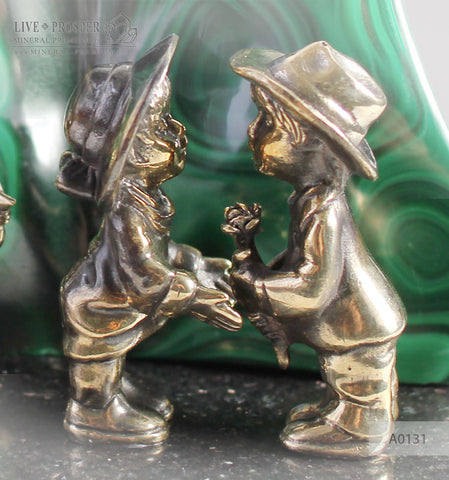 Bronze cupid and sweethearts with citrine sphere on a dolerite plate with malachite background A0131
