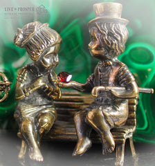 Bronze cupid and sweethearts with garnet heart and malachite background