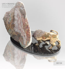 Bronze bull with agate geode amethyst on a dolerite plate
