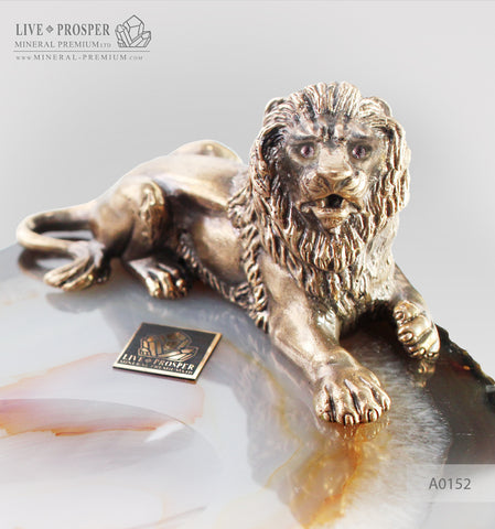 Bronze figure of lion with amethyst inserts on agate plate