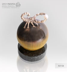 Bronze figure of scorpion on a Chrysoberyl sphere with sea pearl and Swarovski inserts on dolerite plate extra small Бронзовый скорпион на сфере из кошачьего глаза с морской жемчужиной и вставками из Сваровски на пластине из долерита -малый