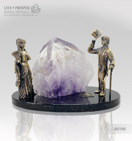 Bronze figures of Gentleman and lady with amethyst on a dolerite plate