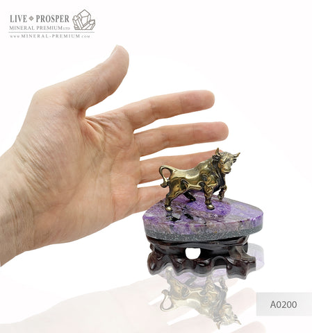 Bronze bull figure with charoite base on a handmade wooden stand