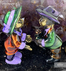Bronze composition of cupid and sweethearts with a rose flower and street light within geode agate amethyst druzy background and amethyst sphere of amethyst on a dolerite plate Бронзовая композиция с амуром, влюблёнными c розой и уличным фонарём на фоне агата жеода аметистовой друзы и сферой из аметиста на пластине из долерита