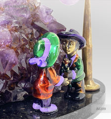 Bronze composition of cupid and sweethearts with a rose flower and street light within geode agate amethyst druzy background and amethyst sphere of amethyst on a dolerite plate Бронзовая композиция с амуром, влюблёнными c розой и уличным фонарём на фоне агата жеода аметистовой друзы и сферой из аметиста на пластине из долерита