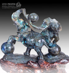 Solid Blue Labradorite carving of Two Elephants playing Balls on a Wooden stand