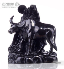 Solid obsidian carving of bull on guard - lunar calendar