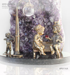 Bronze cupid and sweethearts on a bench with garnet heart with Agate Geode Amethyst and rock- crystal sphere on a dolerite plate Бронзовые амур и влюбленные на лавке с сердцем из граната с жеодой агата аметистовой друзой и шаром из горного хрусталя на пластине из долерита 