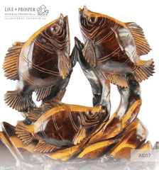 Solid tiger's eye carving of fish family playing under the sea on a wooden stand Стая рыб играющая на морском дне из тигрового глаза на деревянной подставке