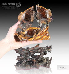 Solid tiger's eye carving of fish family playing under the sea on a wooden stand Стая рыб играющая на морском дне из тигрового глаза на деревянной подставке