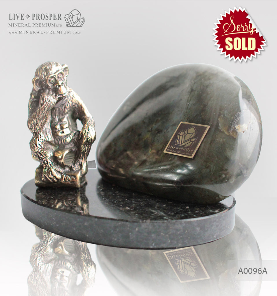 Bronze figure of monkey philosophy with labradorite on dolerite plate