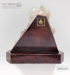 Collectible mineral specimen of Smoky quartz (Rauchtopaz) with Pyrite on a wooden stand
