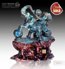Solid Blue Labradorite carving of Two Elephants playing Balls on a Wooden stand