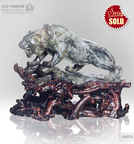 Solid labradorite Tiger carving on a wooden stand