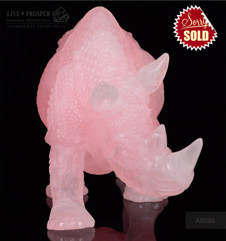 Solid Rose Quartz carvings of Rhinoceros on guard
