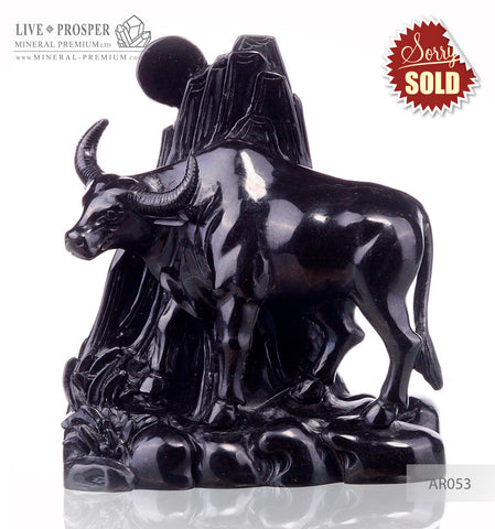Solid obsidian carving of bull on guard - lunar calendar
