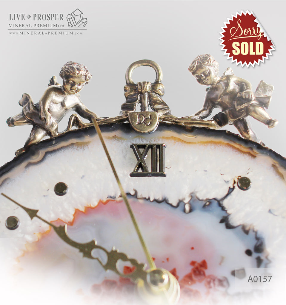 Clock with a bronze Cupid figures on agate plate  A0157